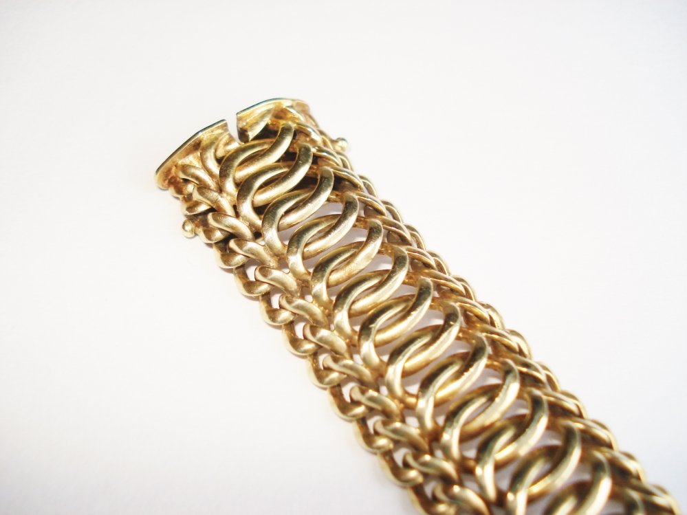 Kettingen en Armbanden - Verkocht Gouden armband golfjes schakels