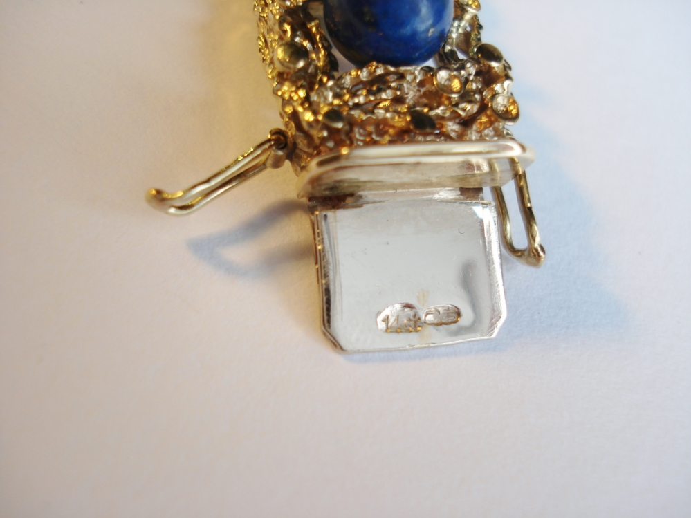 Kettingen en Armbanden - Verkocht Gouden armband met lapis lazuli